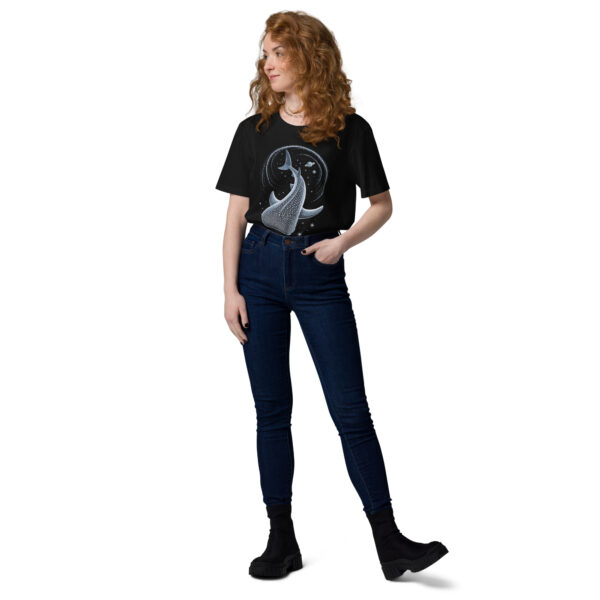 Person wearing a black T-shirt with a large blue whale graphic, paired with dark jeans and chunky black boots, standing sideways.