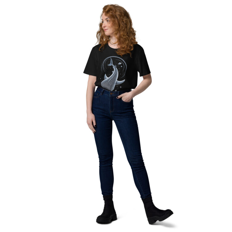 Person wearing a black T-shirt with a large blue whale graphic, paired with dark jeans and chunky black boots, standing sideways.